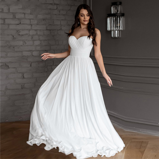 Simple strapless chiffon A-Line gown: ruched bodice, corset-style back, sweetheart neckline, brush train, built-in bra.