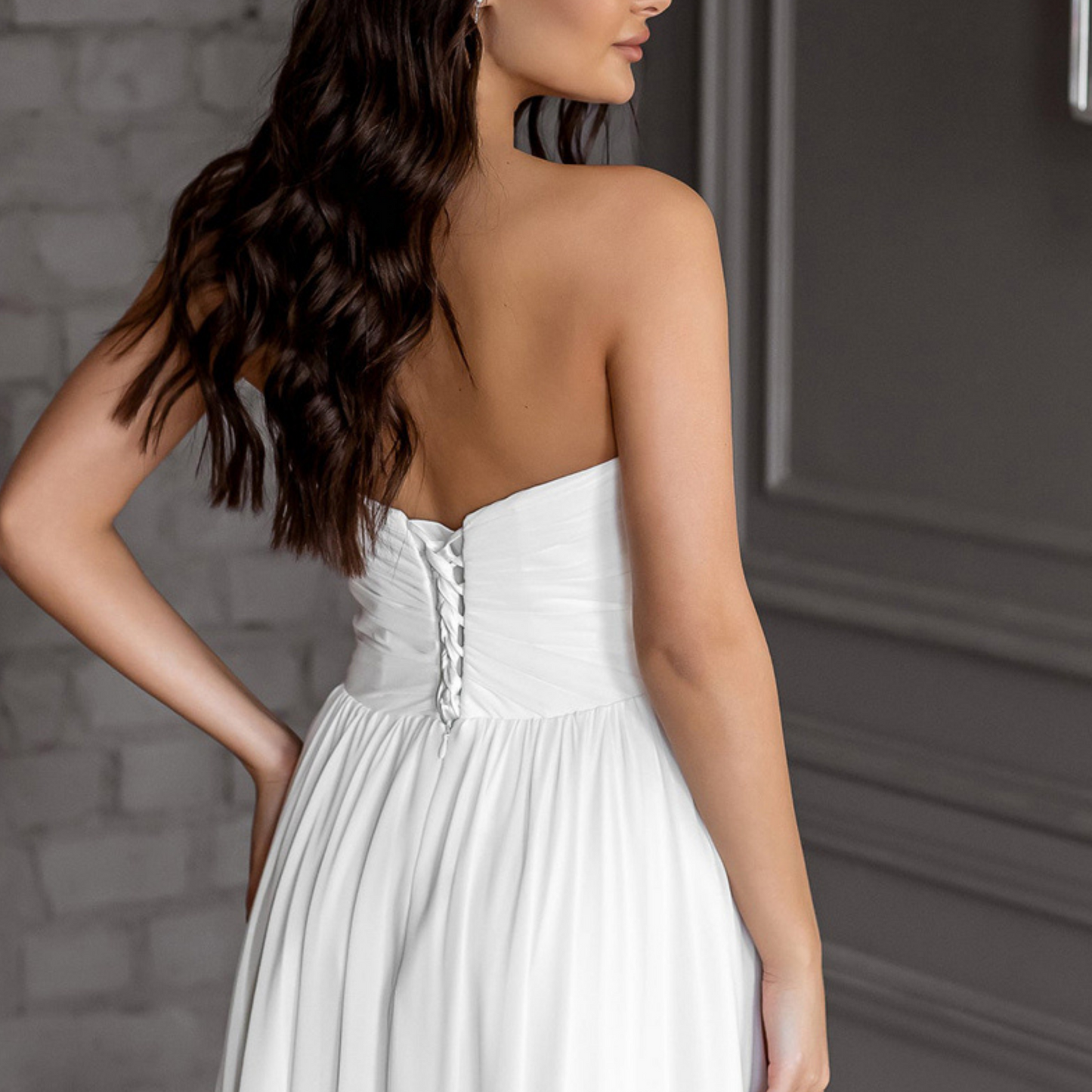 BSimple strapless chiffon A-Line gown: ruched bodice, corset-style back, sweetheart neckline, brush train, built-in bra.