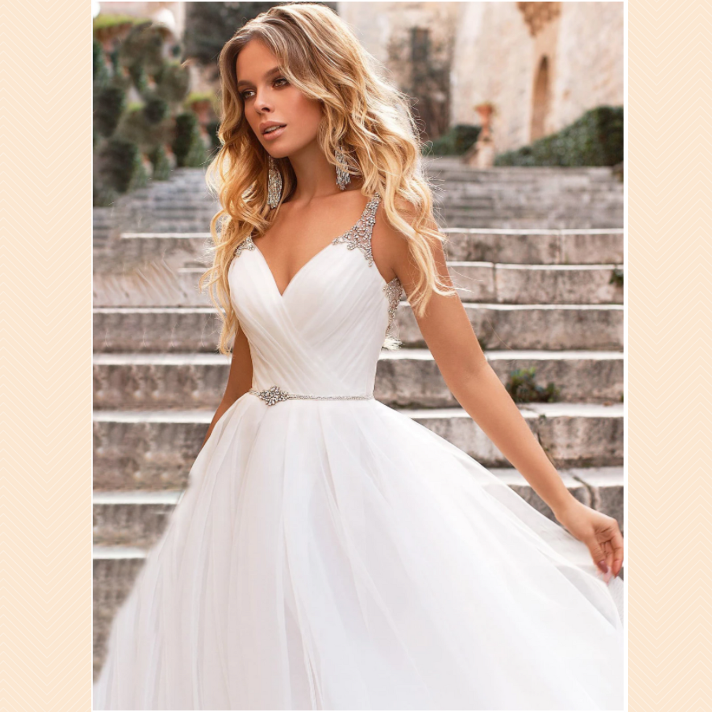 Elegant A-line backless wedding gown: diamante crystal sash, sweetheart neckline, tulle, built-in bra, brush train.